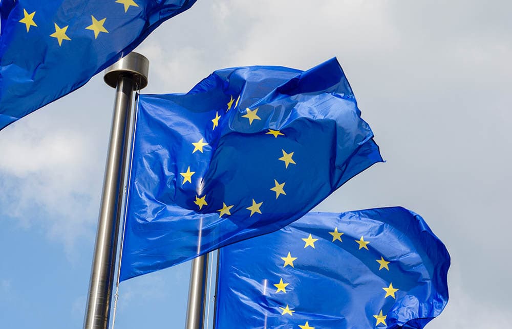 An image of three european flags An image of three european flags