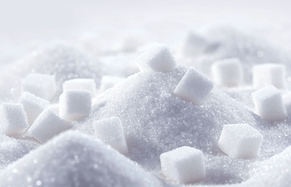 An image of a pile of sugar and sugar cubes An image of a pile of sugar and sugar cubes